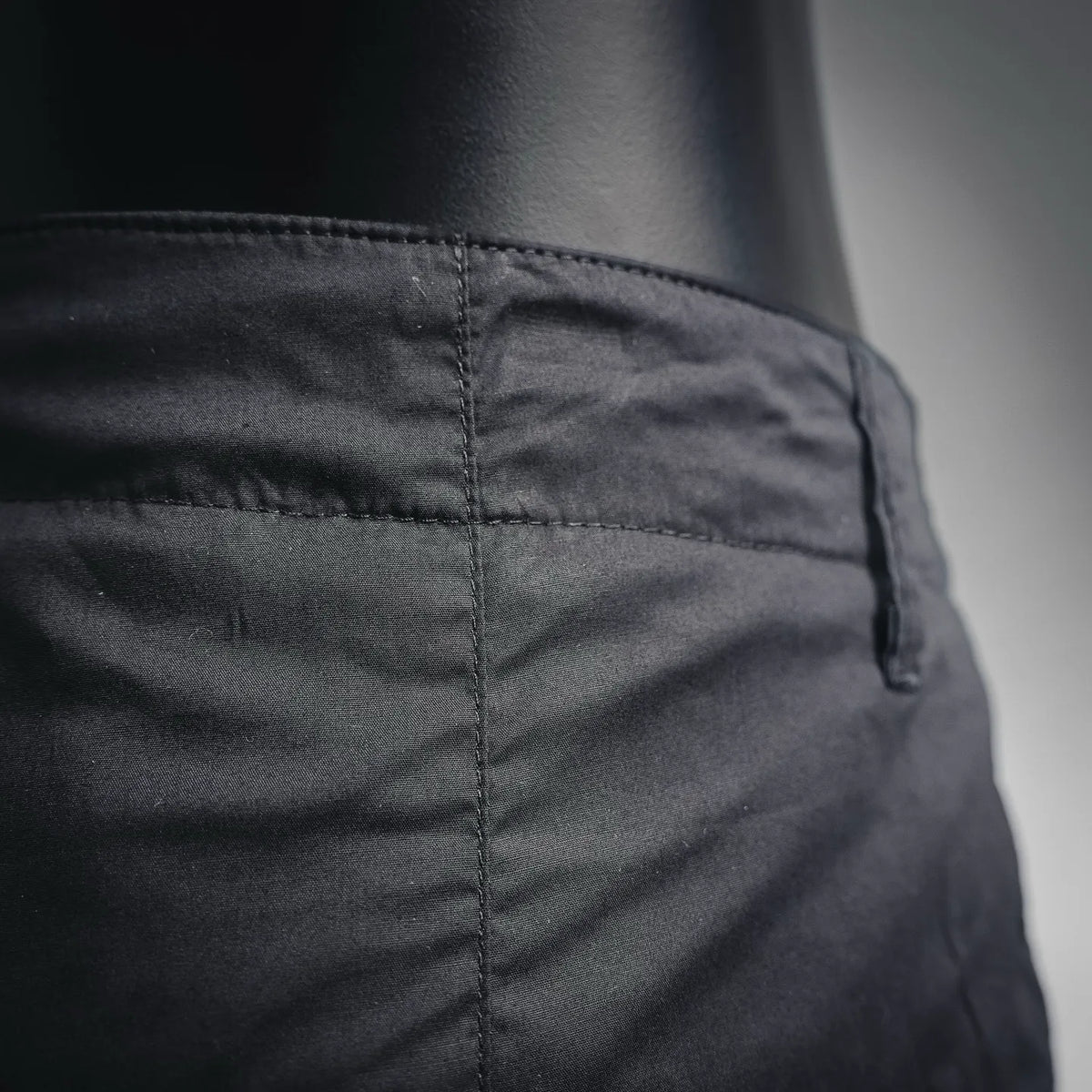 Black pants with stitched front pocket seam detail