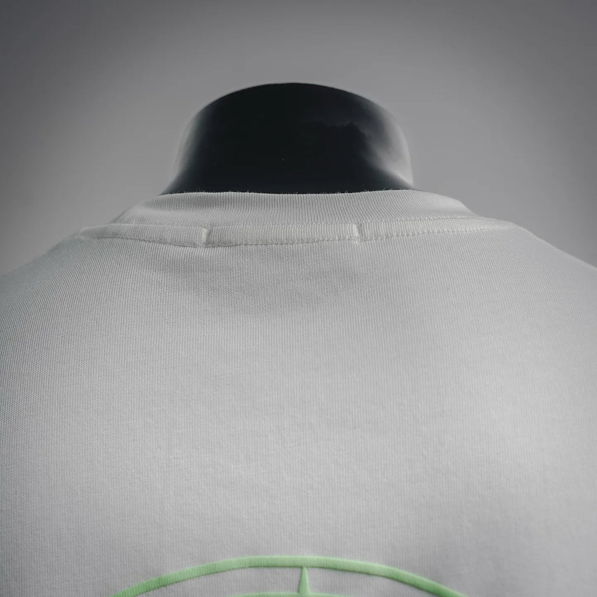 White T-shirt back collar area with top seam detail