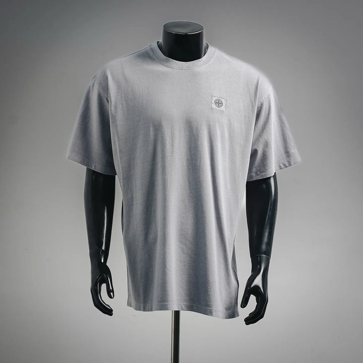 Light gray Stone Island crew-neck T-shirt with small chest logo.