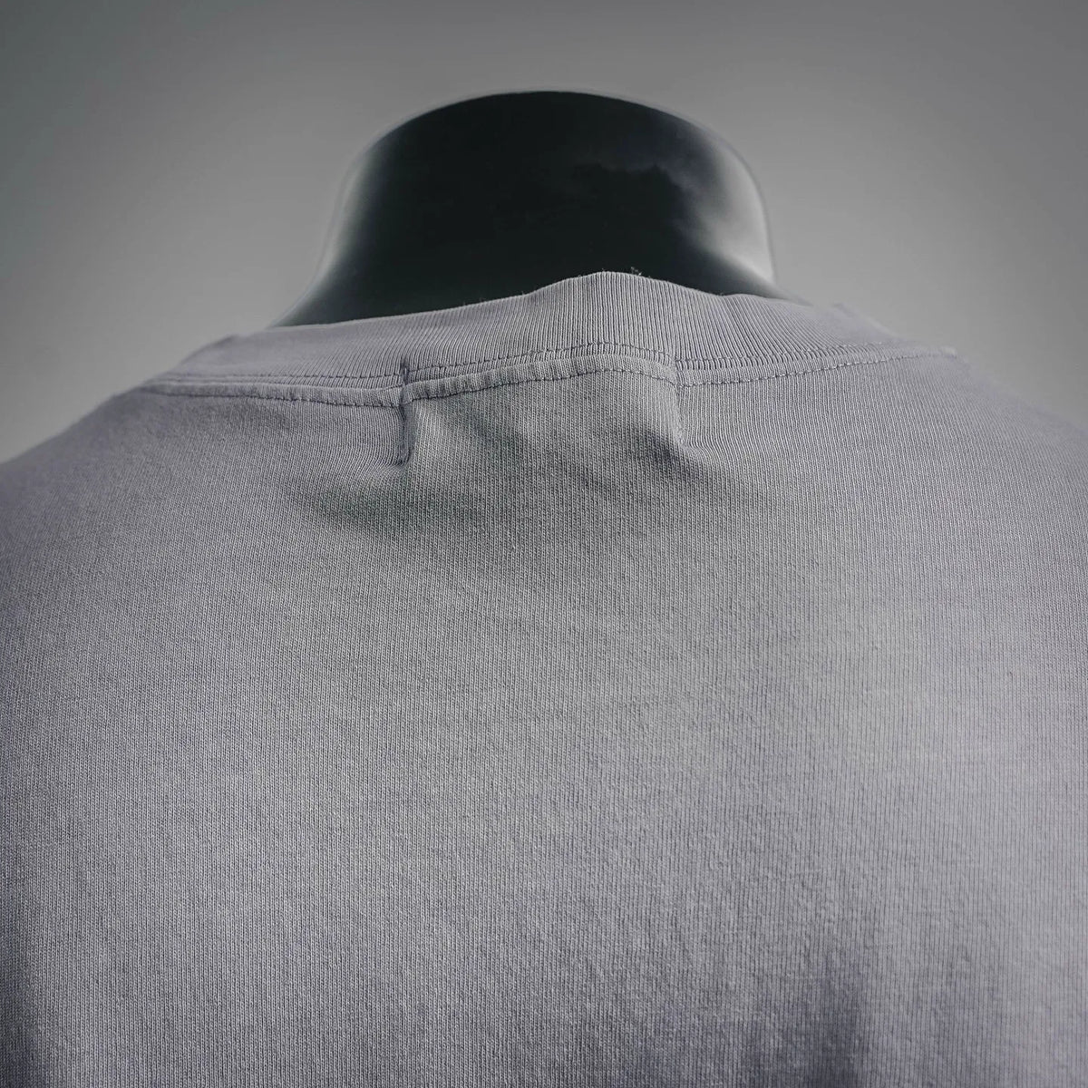 Light gray Stone Island crew-neck T-shirt with ribbed back collar detail.