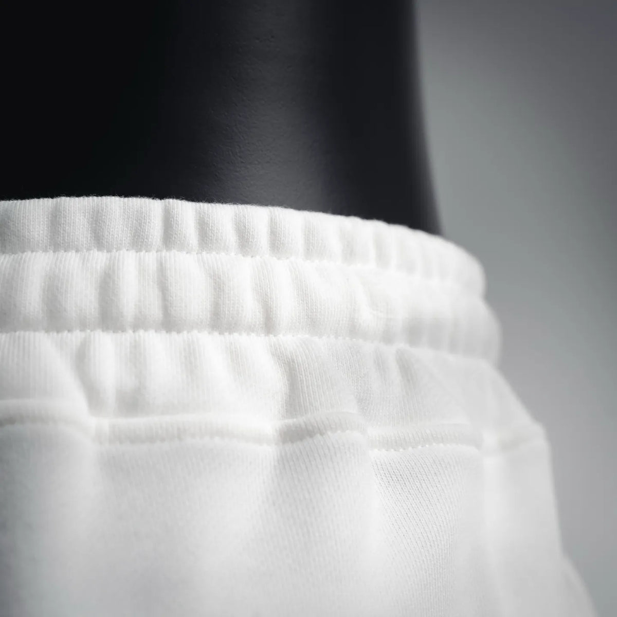 White shorts with ribbed elastic waistband texture