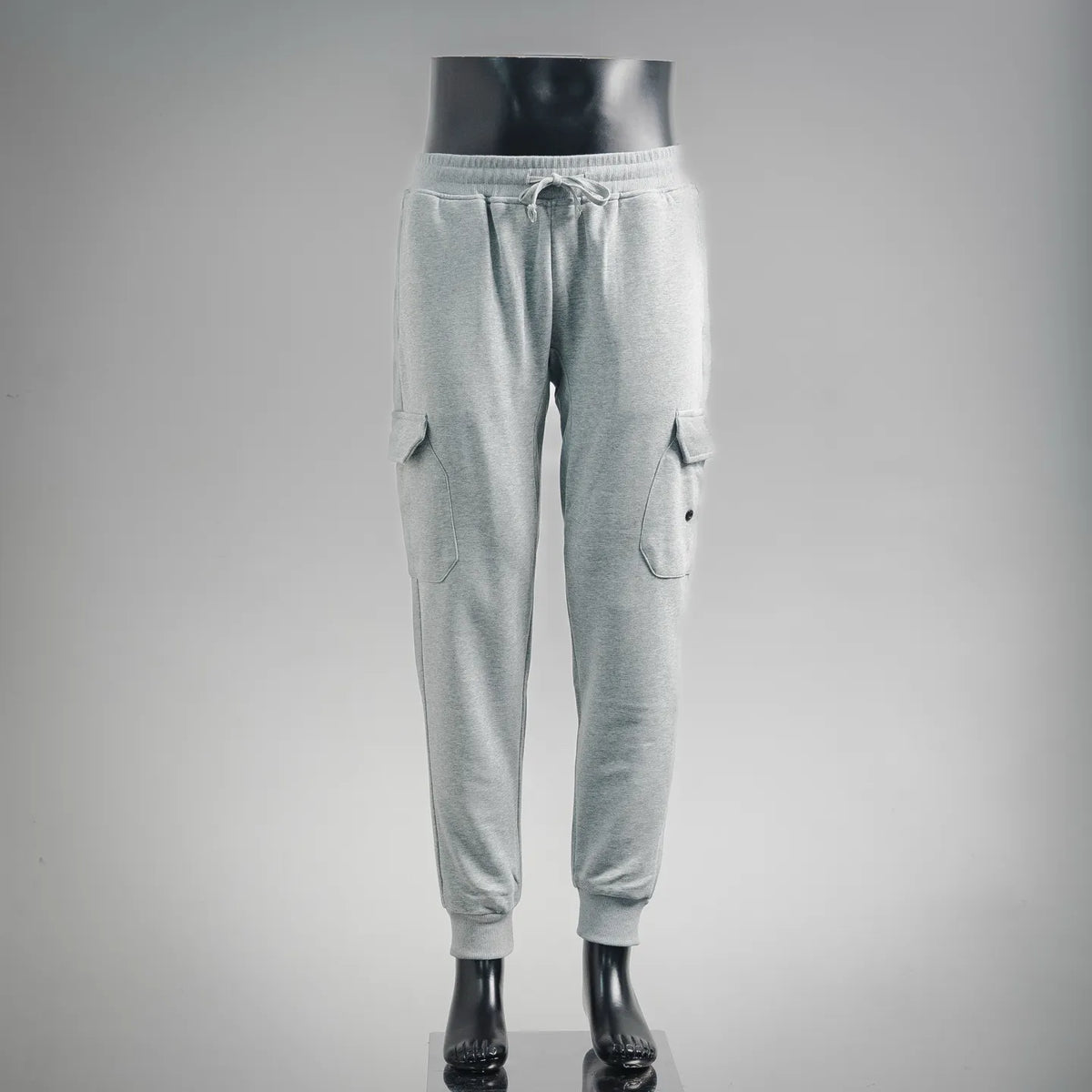 Light gray jogger pants with elastic waistband and side cargo pockets