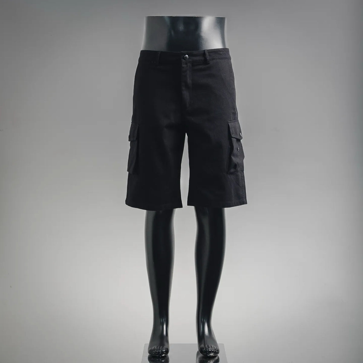 Stone Island black cargo shorts with button closure and side utility pockets