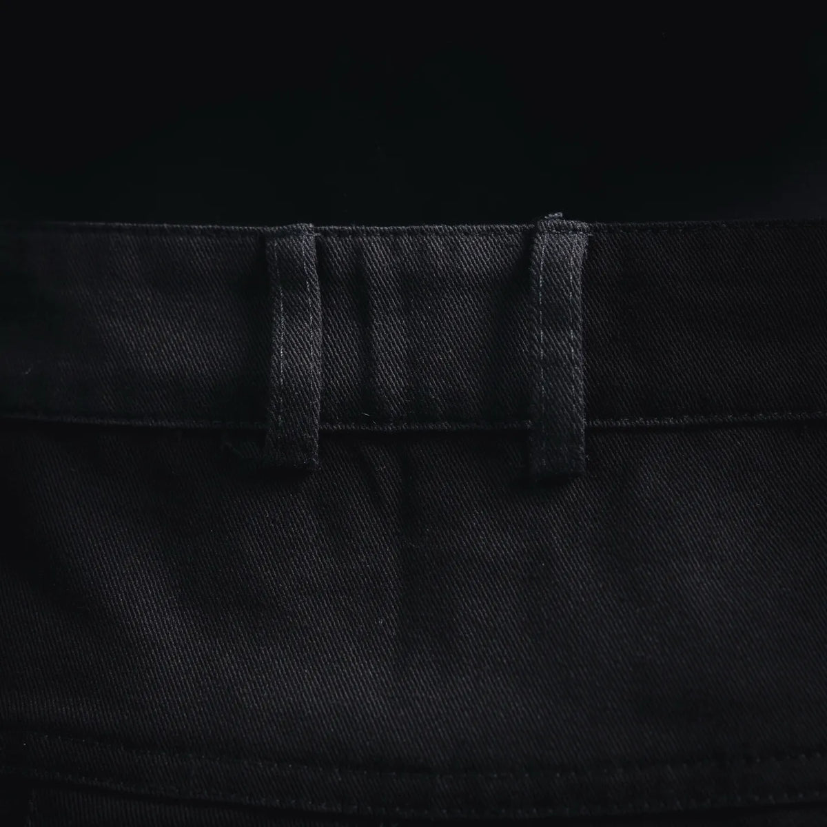 Stone Island black shorts waistband and button fly close-up