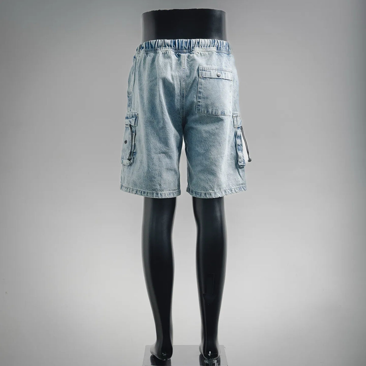 Light blue denim shorts with cargo side pockets and relaxed fit