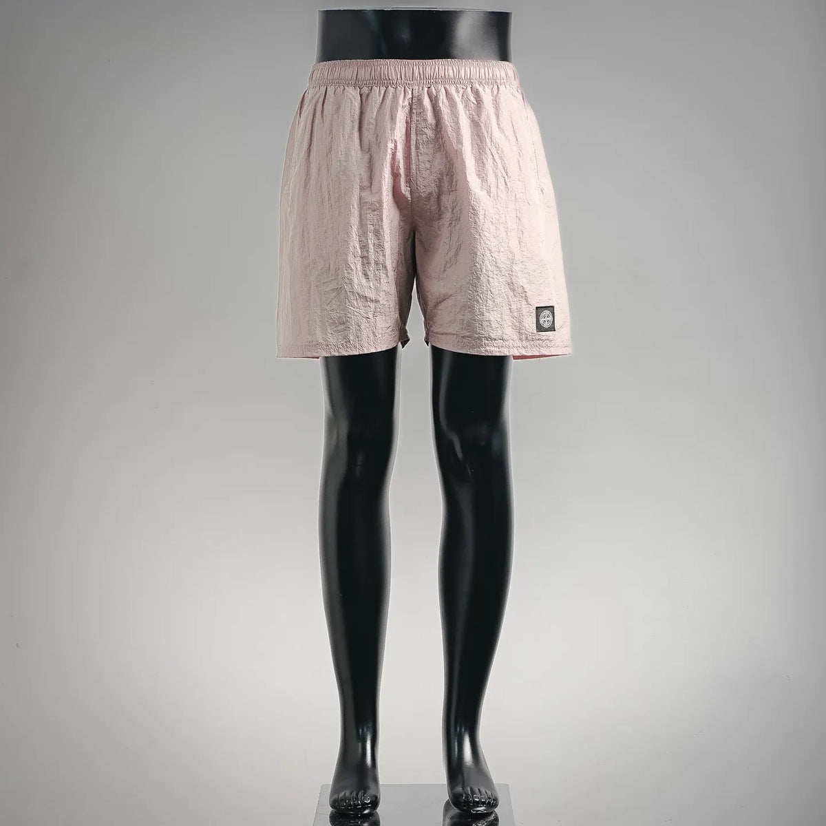 Light pink pull-on shorts with elastic waist and front slit pockets