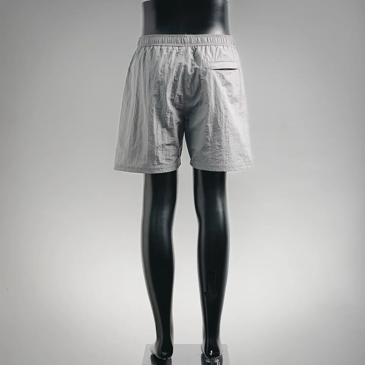 Stone Island light gray drawstring shorts, rear view with elastic waistband