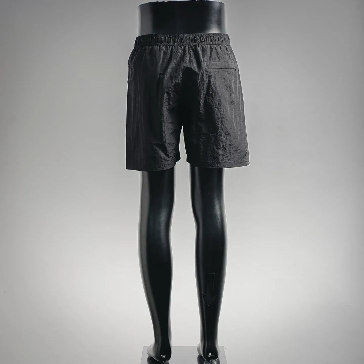 Black shorts-style pants with elastic waist and straight hem