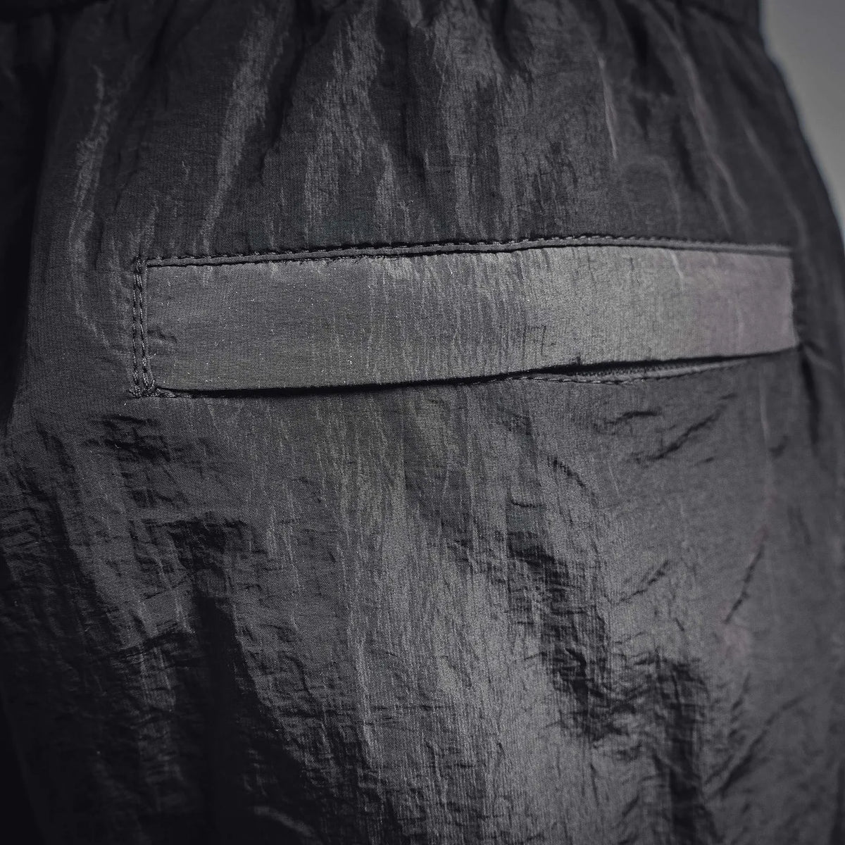 Black pants with stitched inner waistband facing and textured fabric