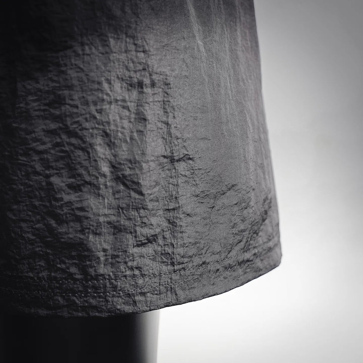 Black pants with textured fabric finish and side seam detail
