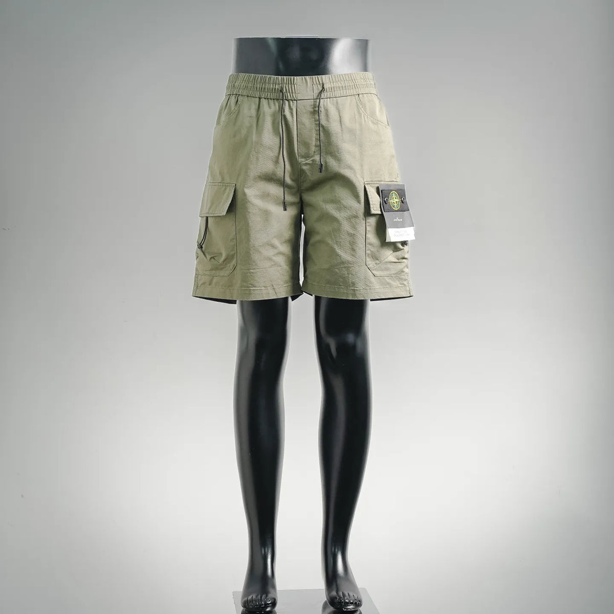 Olive drawstring cargo shorts with side cargo pockets and elastic waistband