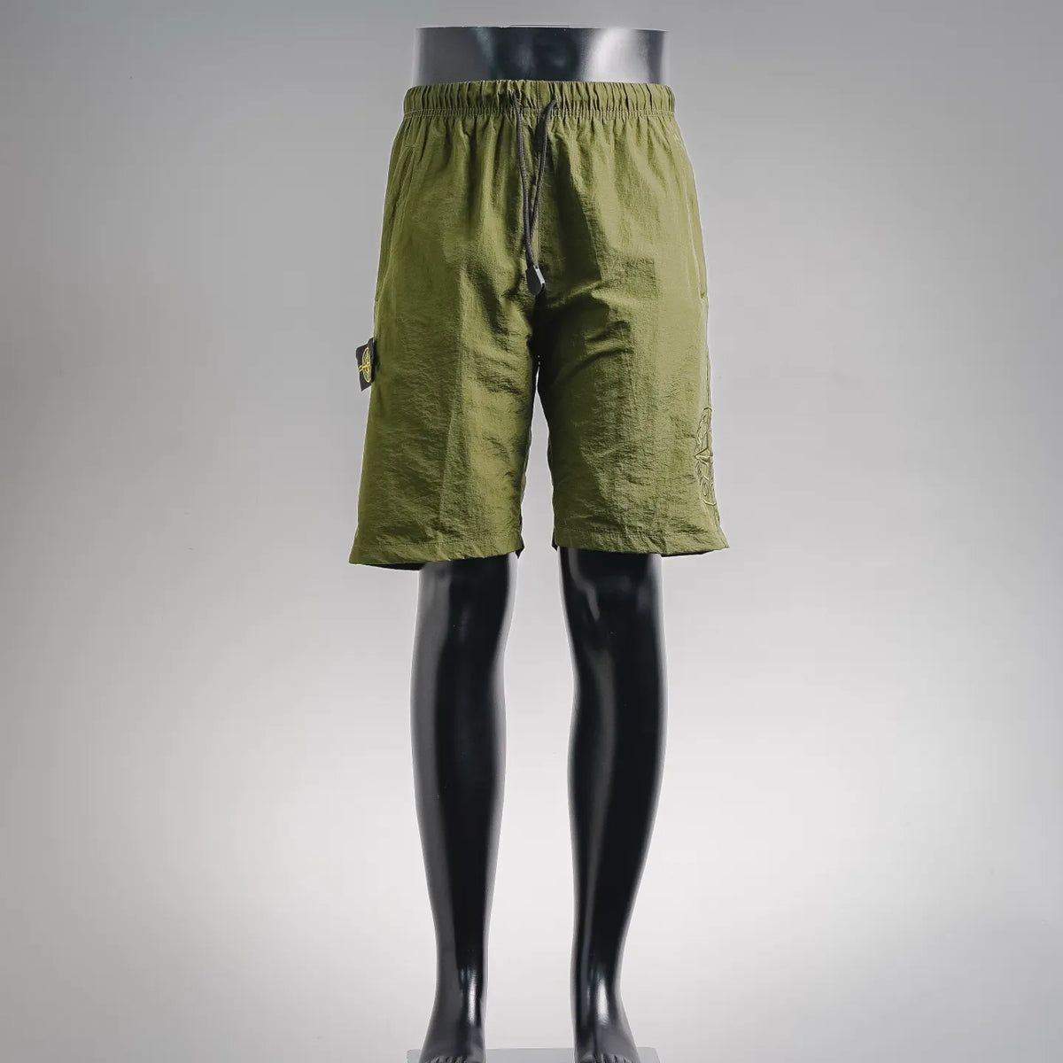 Stone Island olive green shorts with elastic waistband and drawstring, side hand pockets