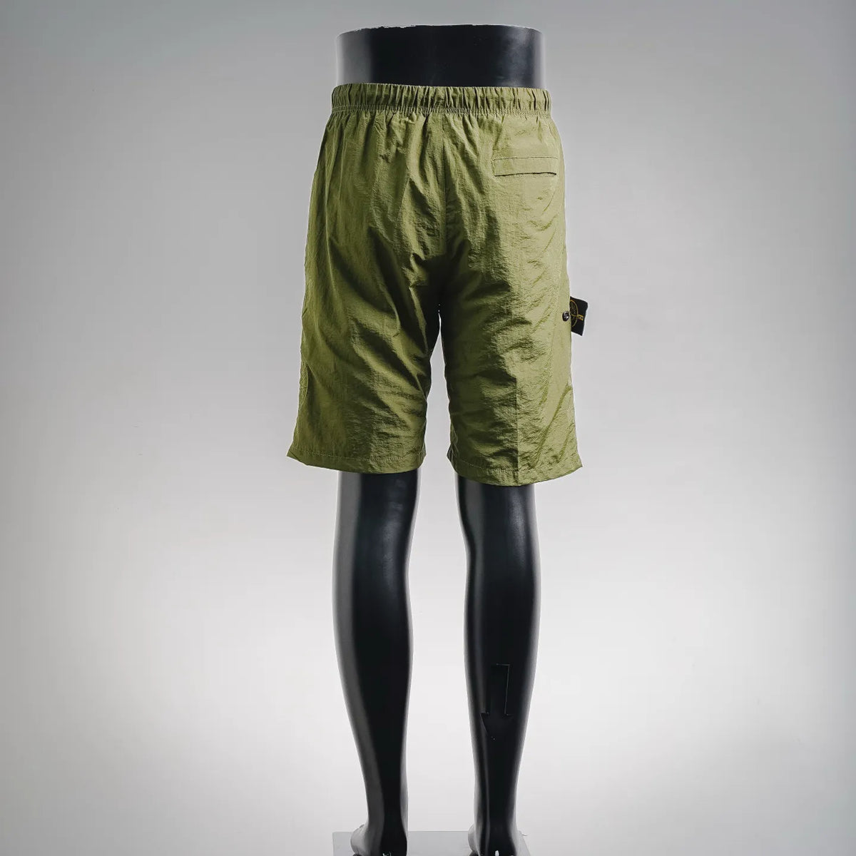 Stone Island olive green shorts rear view with elastic waistband and stitched pockets