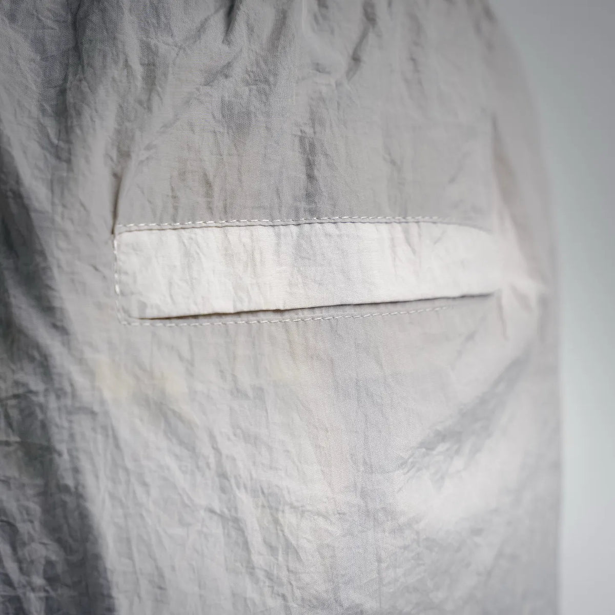 Stone Island shorts close-up of front pocket panel with stitched trim