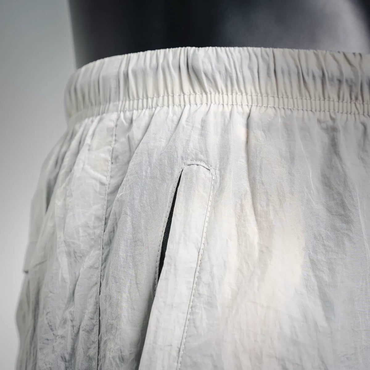 Stone Island shorts close-up of front cargo pocket with pleated panel detail