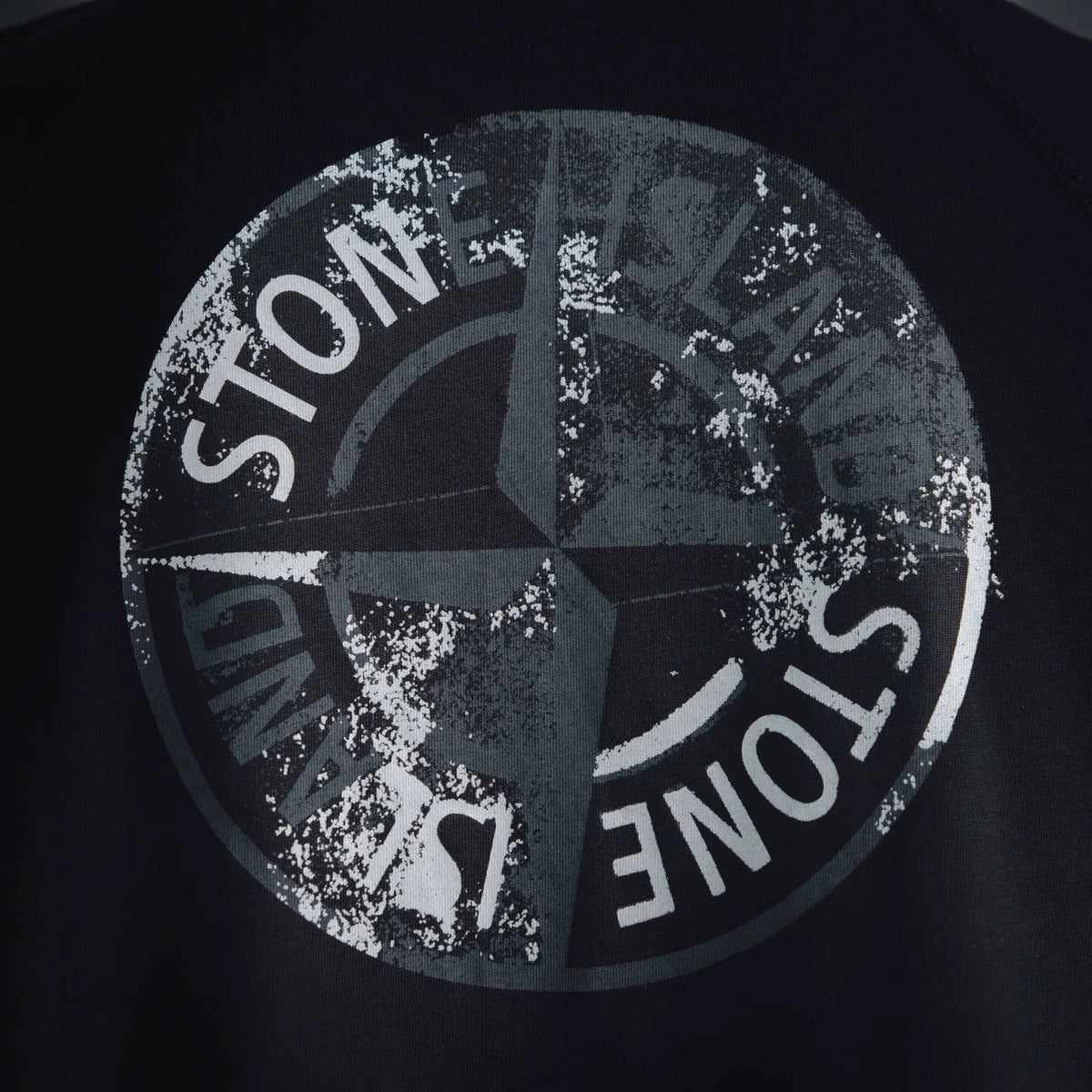 Stone Island black T-shirt close-up of large circular back logo print