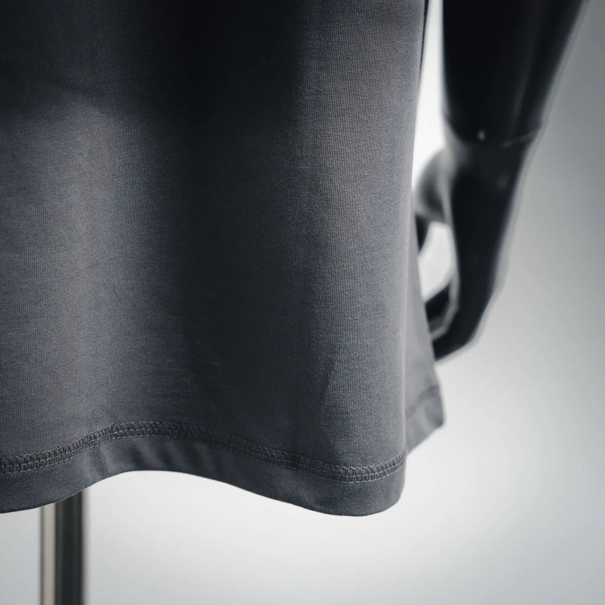Stone Island dark gray crew-neck T-shirt sleeve and bottom hem close-up
