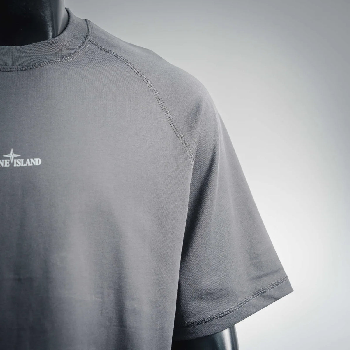 Stone Island dark gray crew-neck T-shirt shoulder seam and partial chest logo
