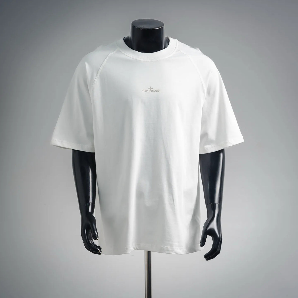White short-sleeve T-shirt on mannequin with small chest logo