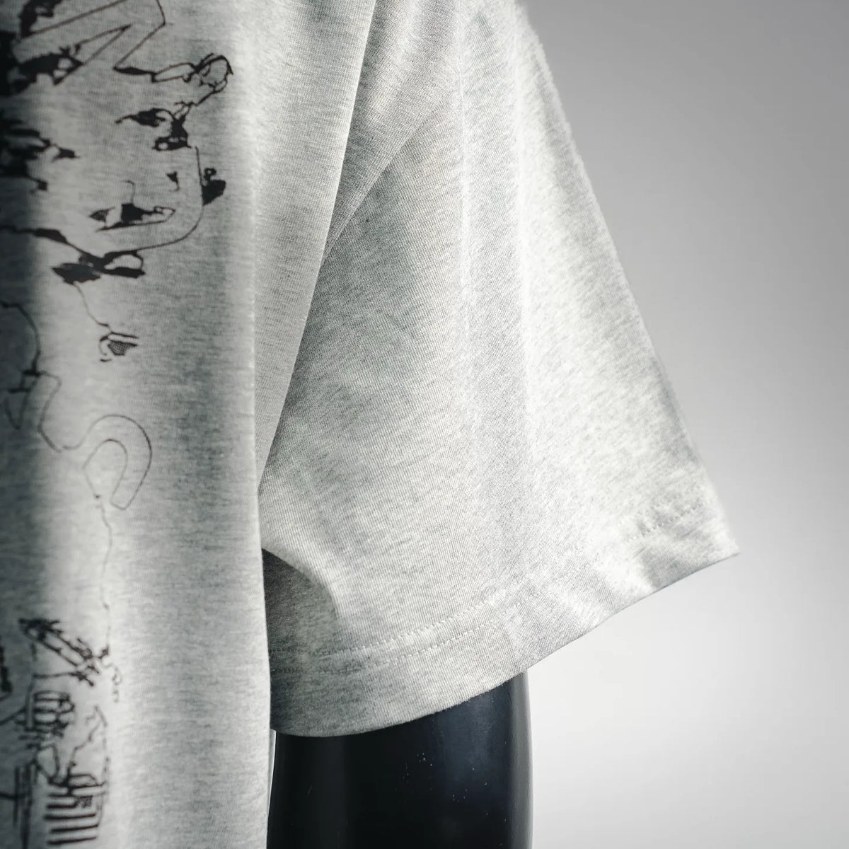 Light gray T-shirt with partial black abstract back graphic detail