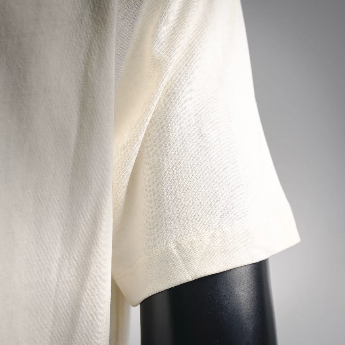 Stone Island short-sleeve T-shirt, light cream, close-up of sleeve and side panel