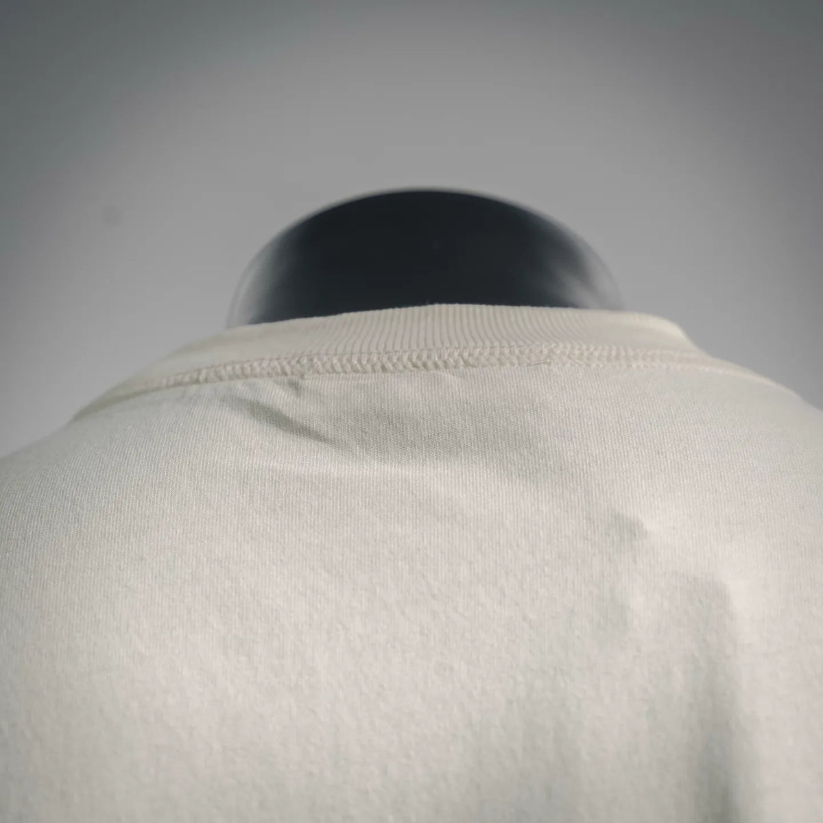 Stone Island short-sleeve T-shirt, light cream, close-up of back neckline and stitching