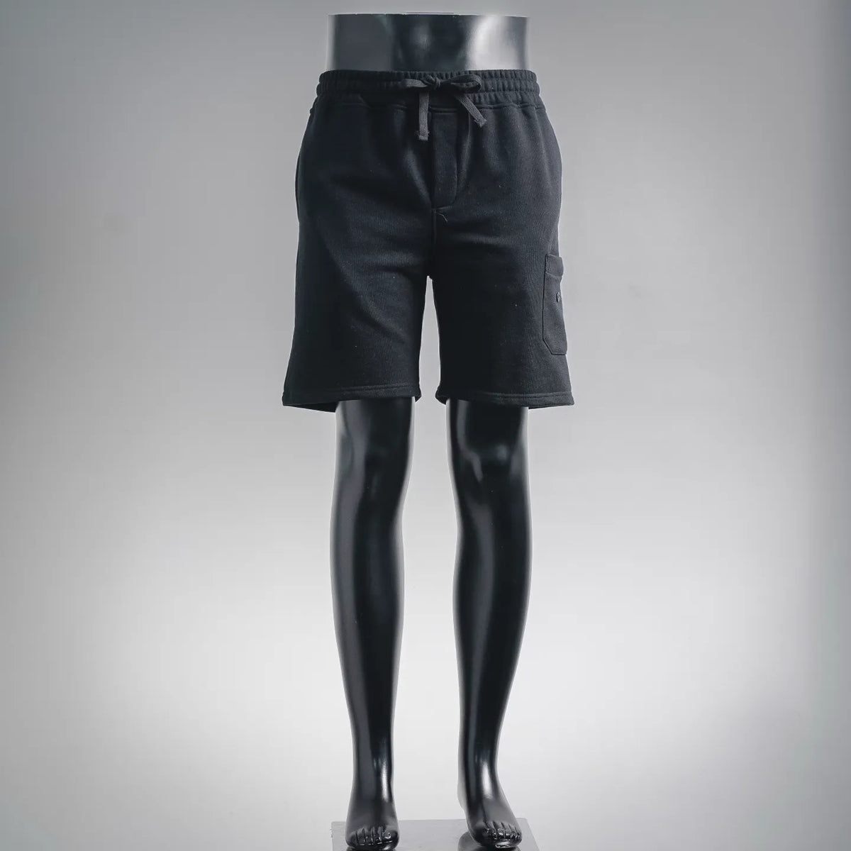 Stone Island dark shorts with elastic waistband, drawstring, and side cargo pockets