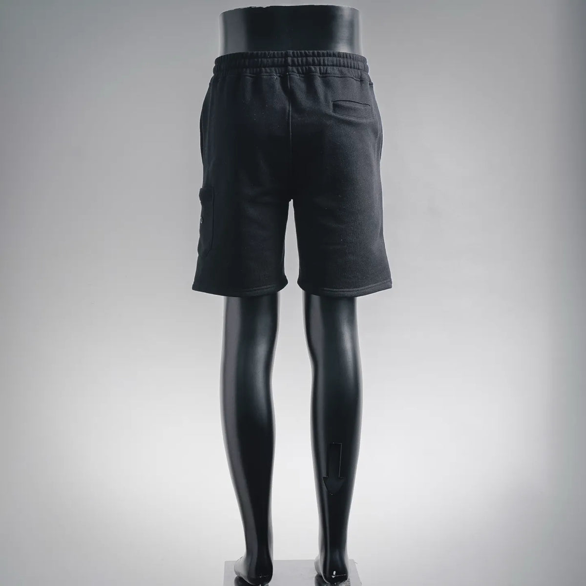 Stone Island dark shorts with elastic waistband and side cargo pockets, back view