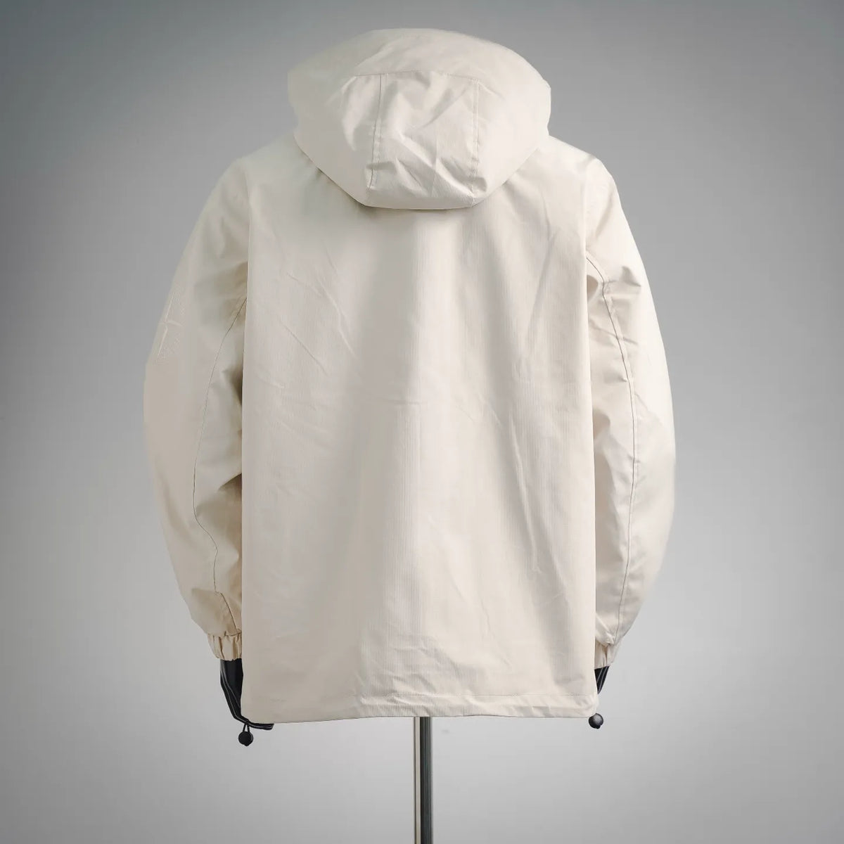 White hooded coat, rear view with adjustable hood and drawcord