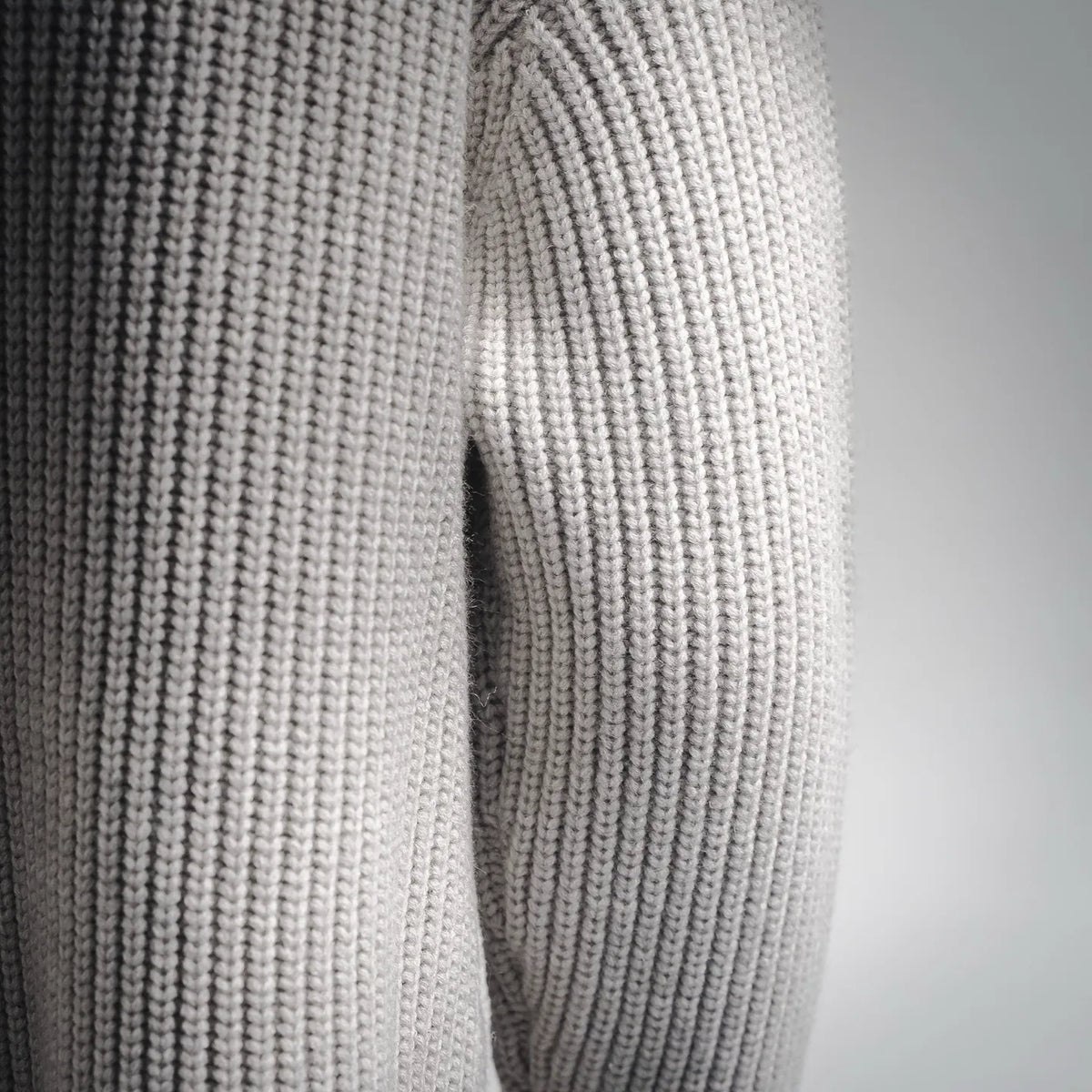 Stone Island light gray knit sleeve with ribbed cuff and textured vertical stitching