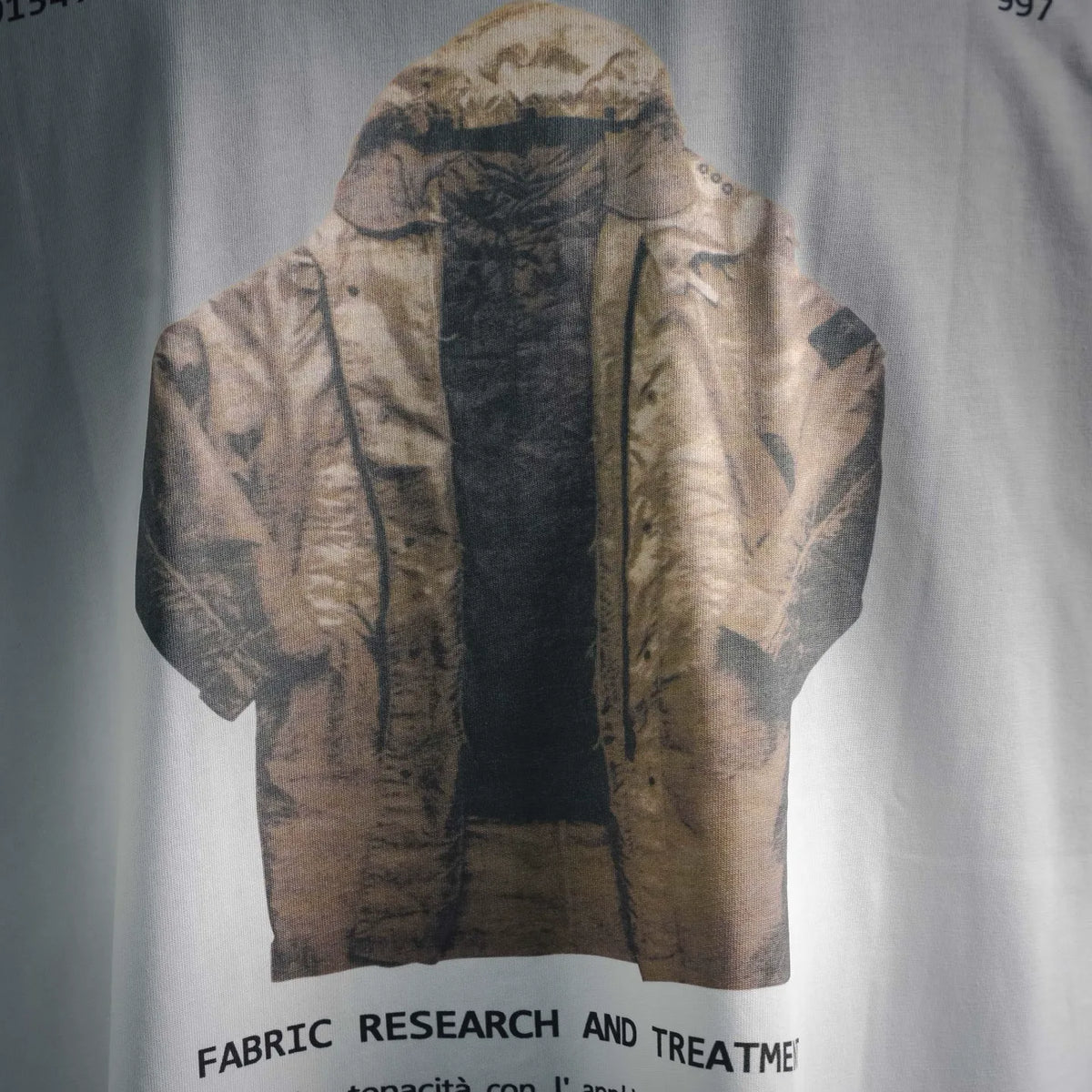White T-shirt back print showing a hooded jacket graphic
