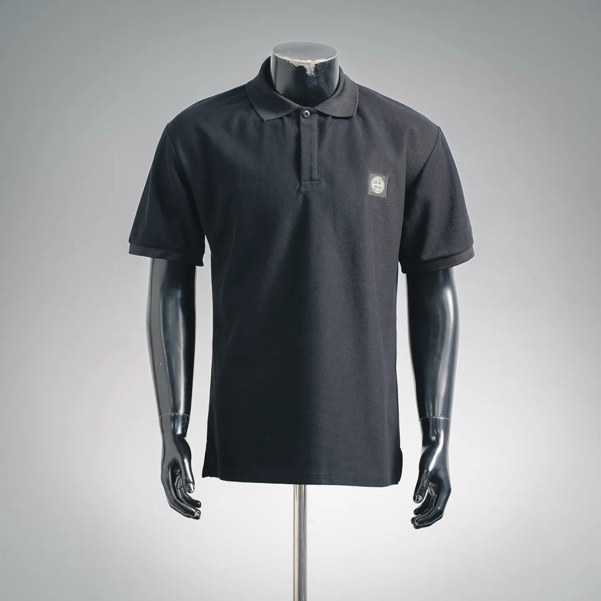 Stone Island short-sleeve polo shirt, dark navy/black, button placket, chest logo patch
