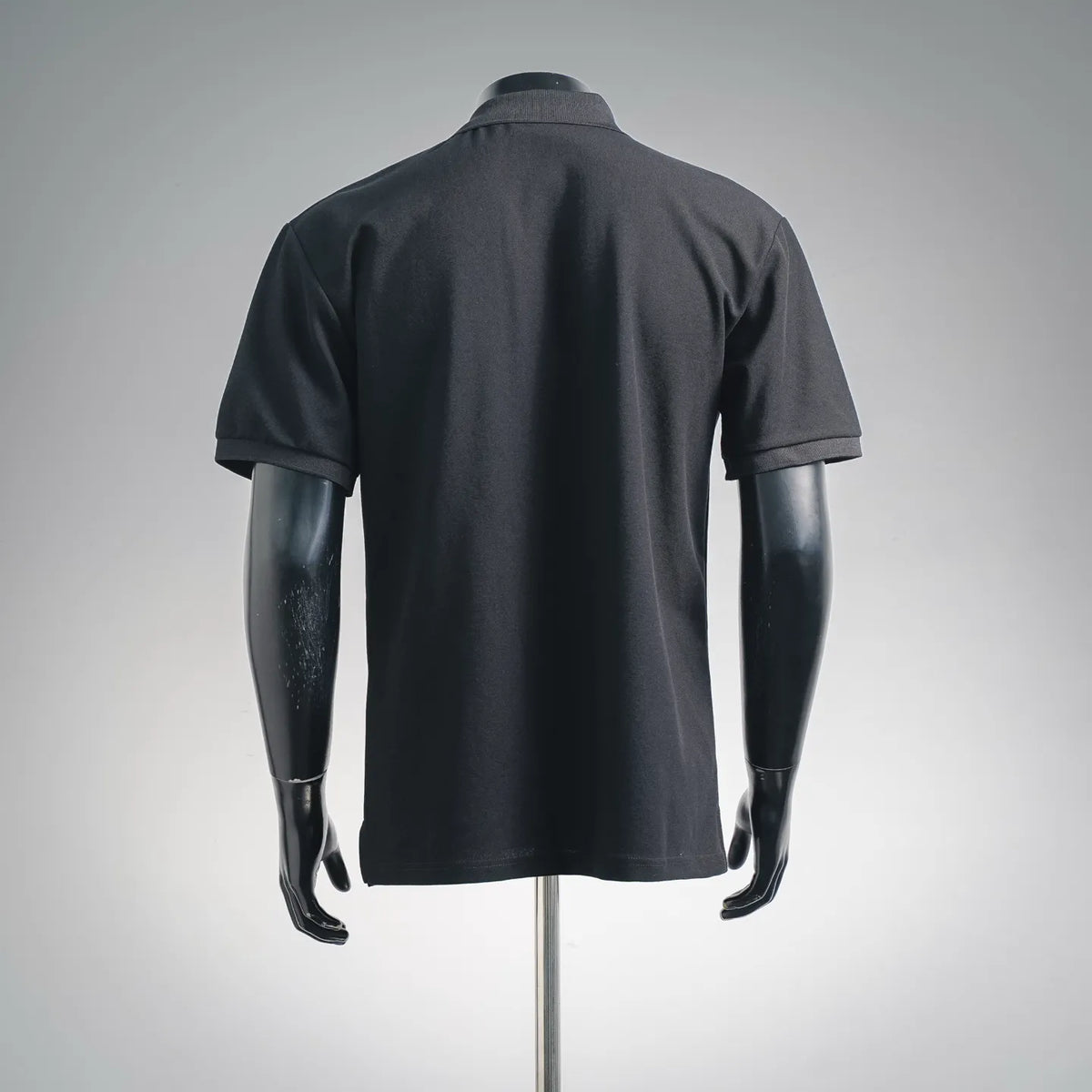 Stone Island short-sleeve polo shirt, dark navy/black, plain back view