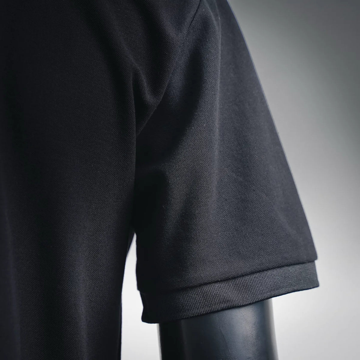 Stone Island polo shirt sleeve cuff, dark navy/black, stitched ribbed trim
