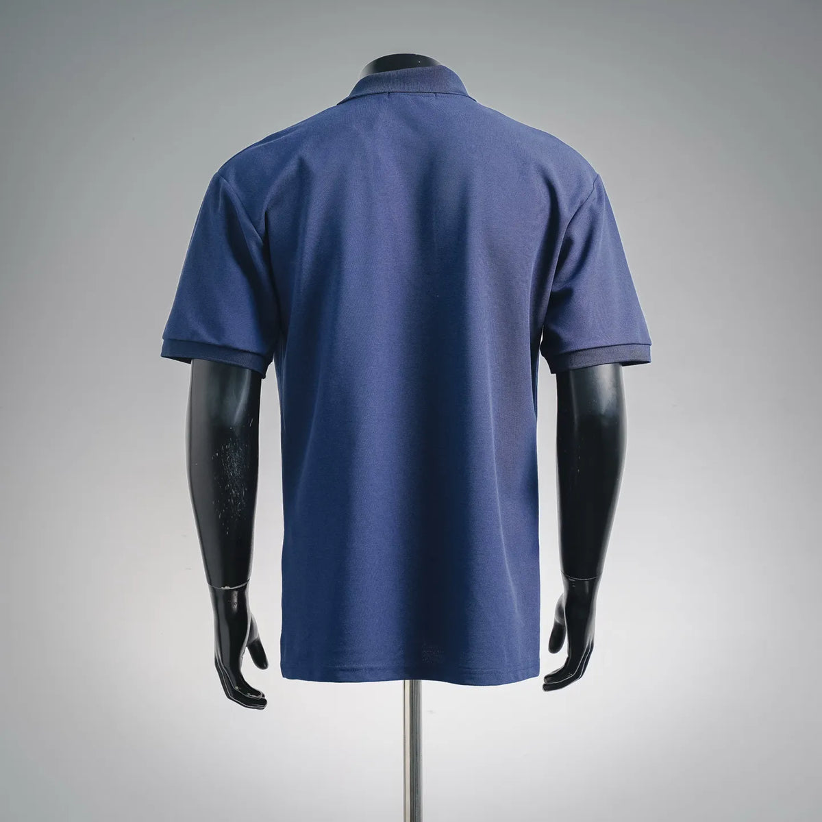Stone Island blue polo shirt, back view with short sleeves