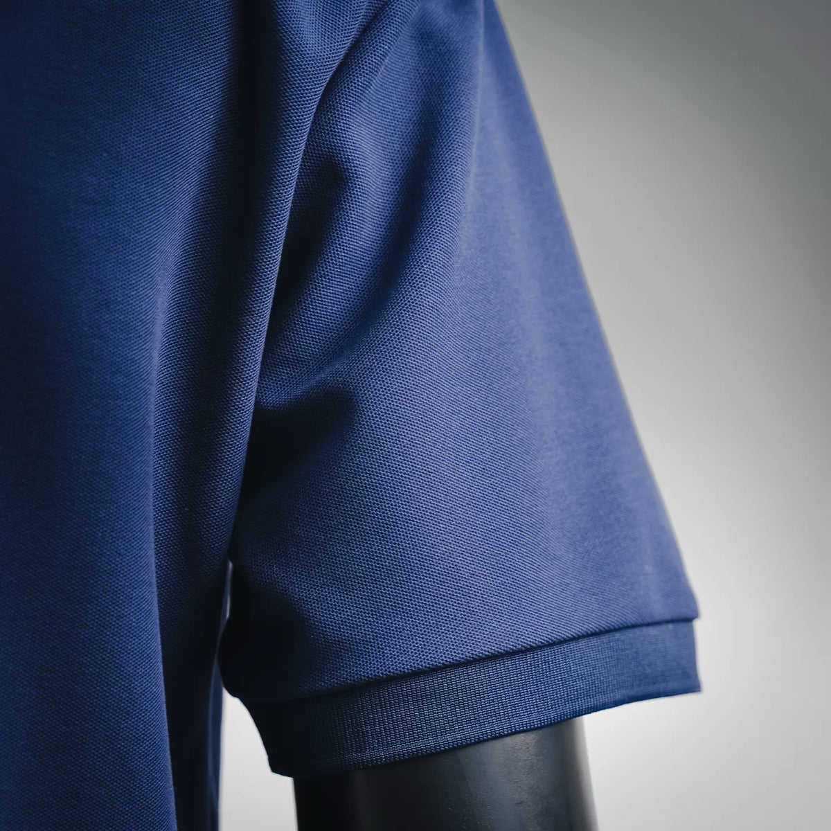 Stone Island blue polo shirt sleeve cuff and shoulder seam detail