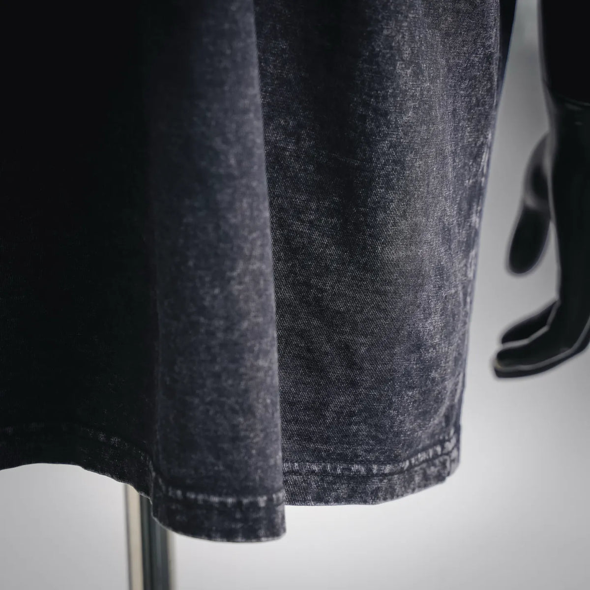 Dark gray short-sleeve t-shirt with straight hem and faded wash