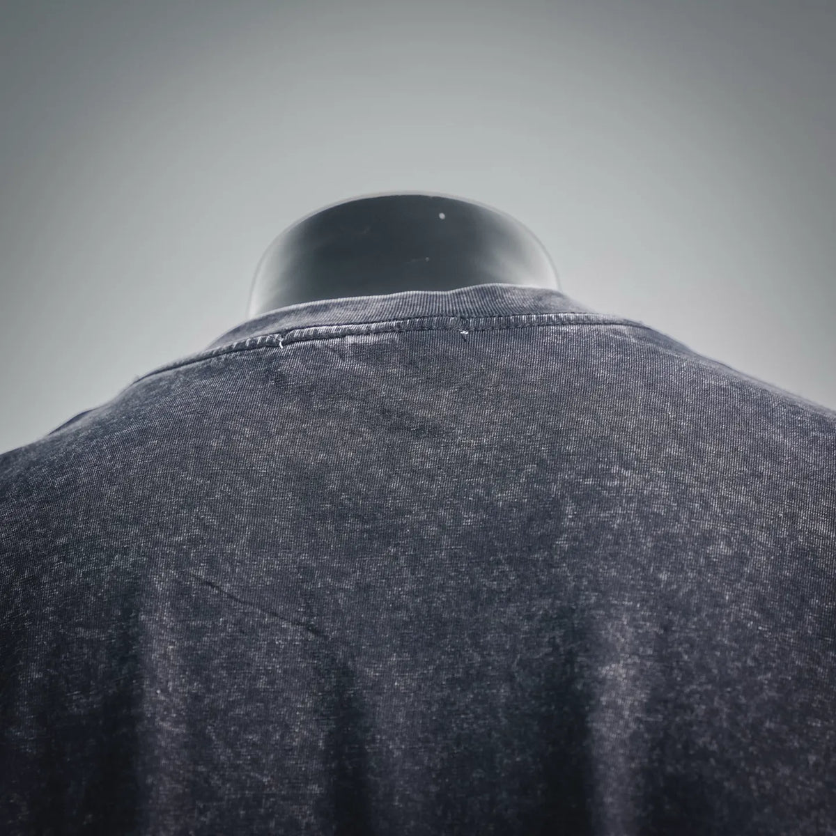 Dark gray short-sleeve t-shirt back view with collar seam