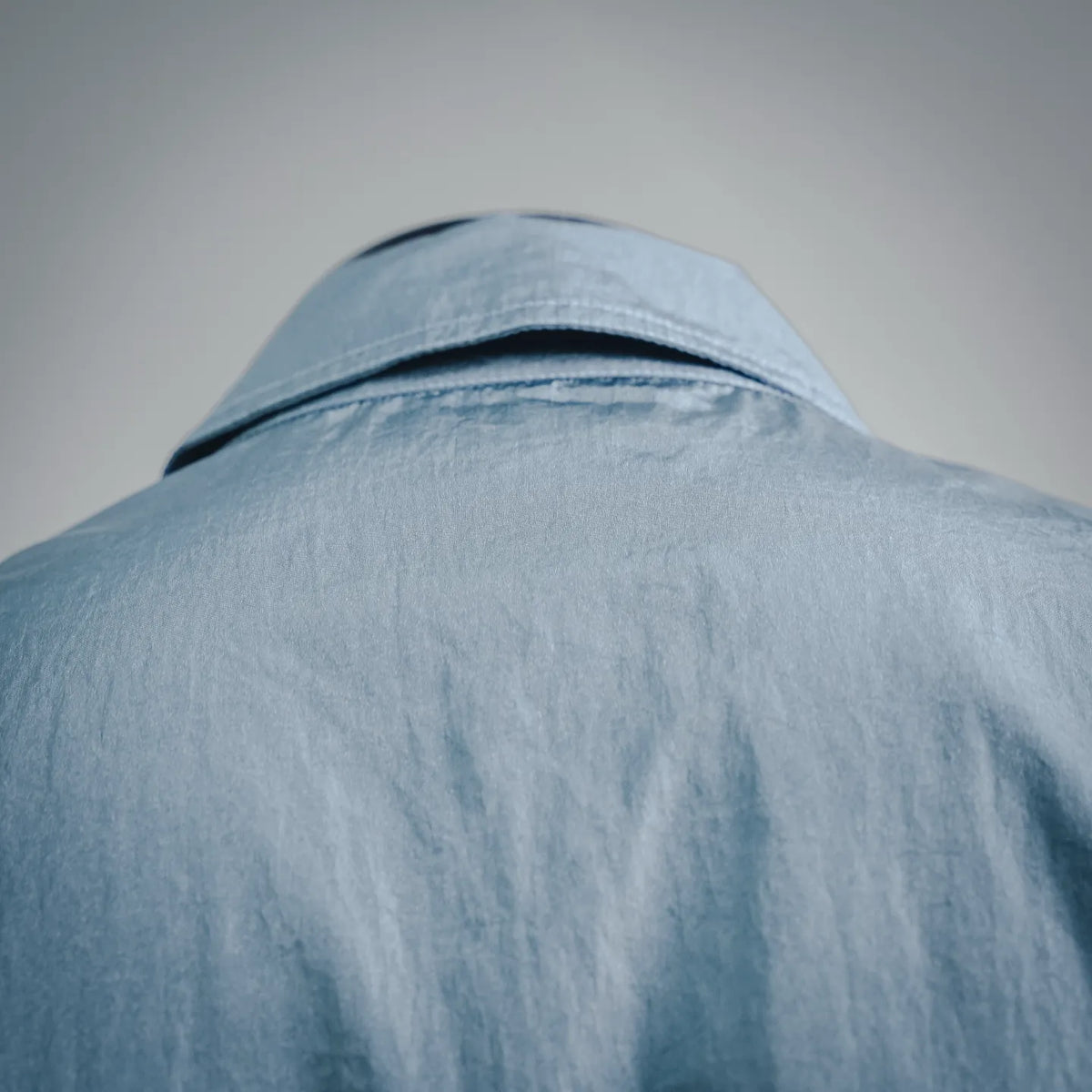 Light blue Stone Island coat hood and back collar detail