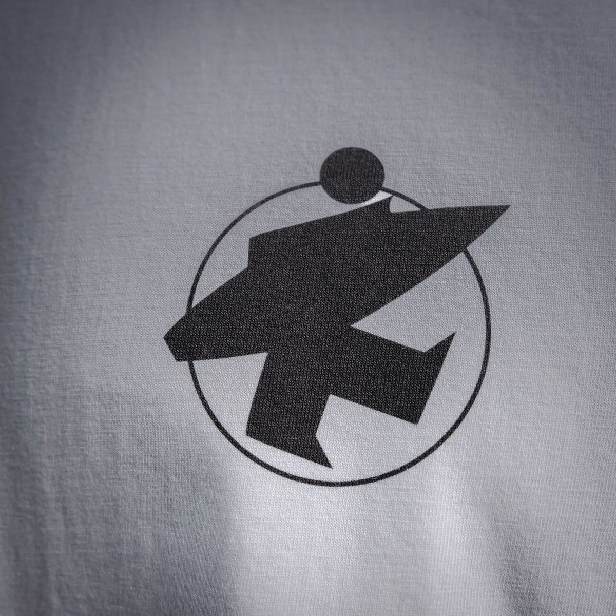 White T-shirt front logo: black circular icon graphic