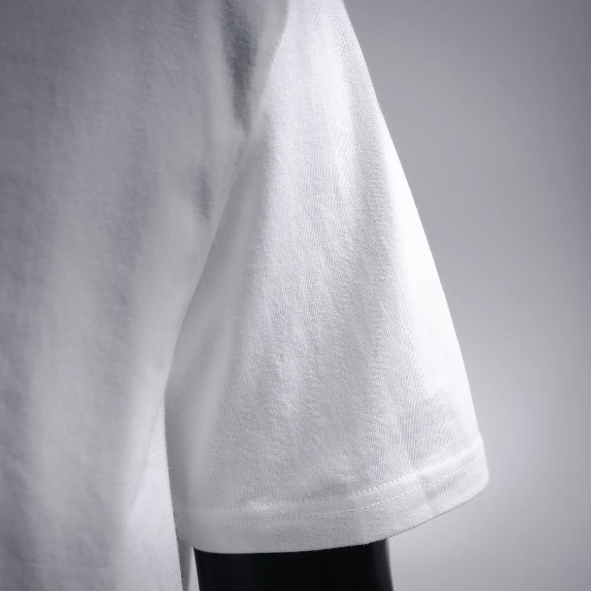 White short-sleeve T-shirt, plain side close-up