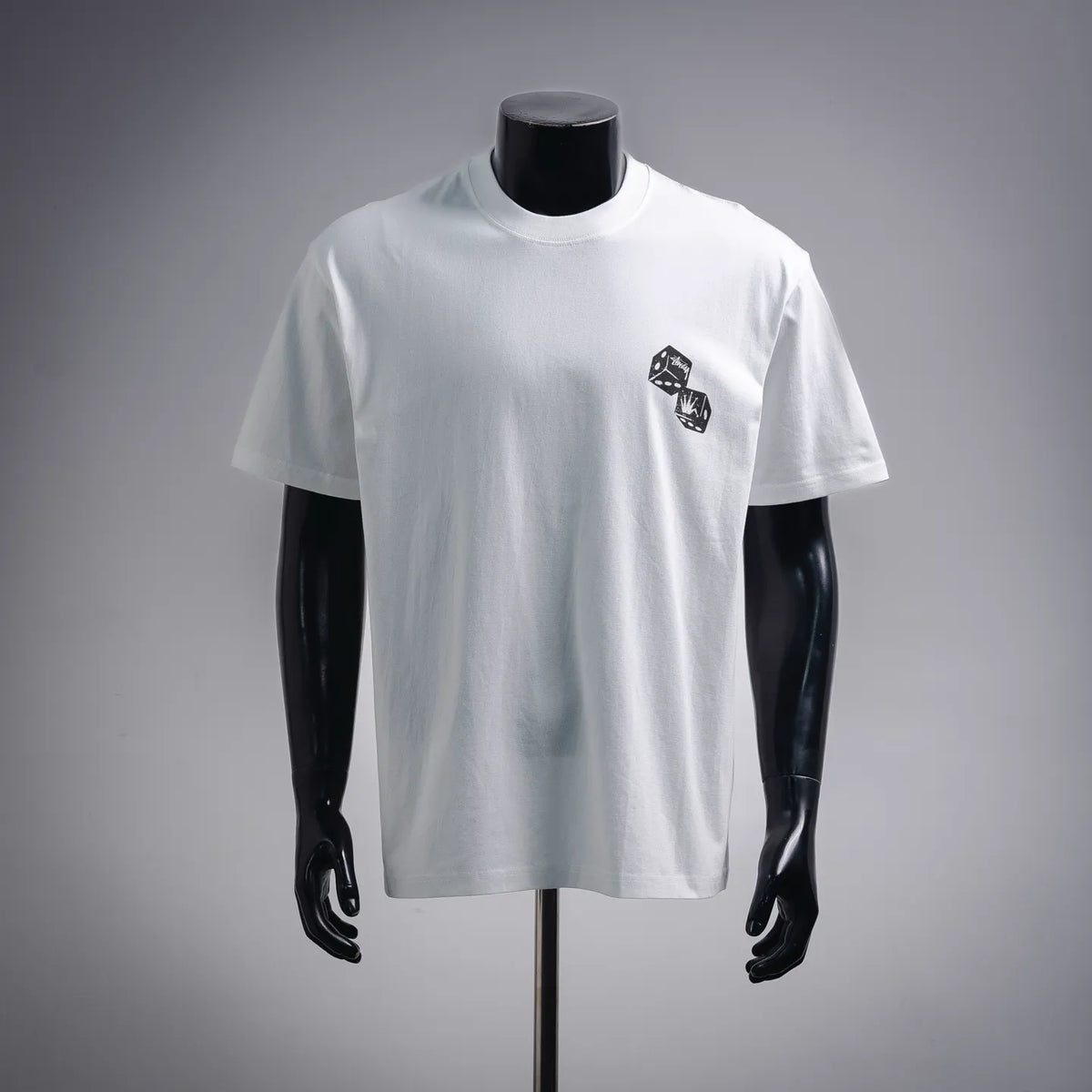 White Stussy short-sleeve T-shirt with small black dice-style chest graphic