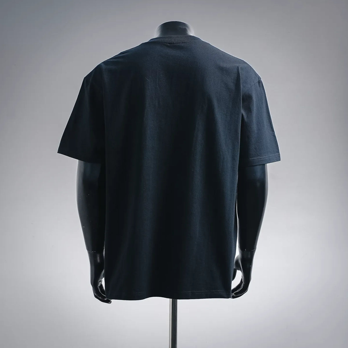 Stussy graphic T-shirt back view with round neckline and short sleeves