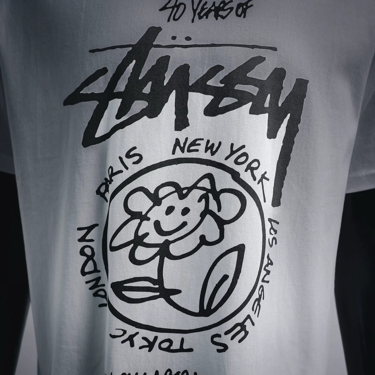 White T-shirt front with large black graphic artwork