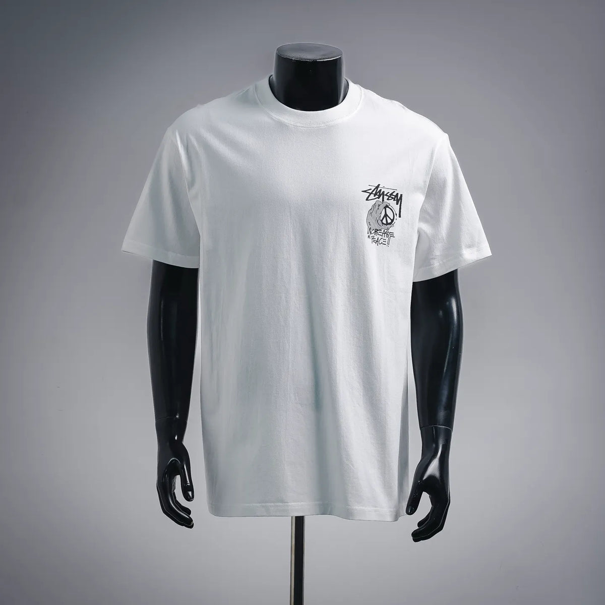 White short-sleeve T-shirt with small front Stussy logo graphic