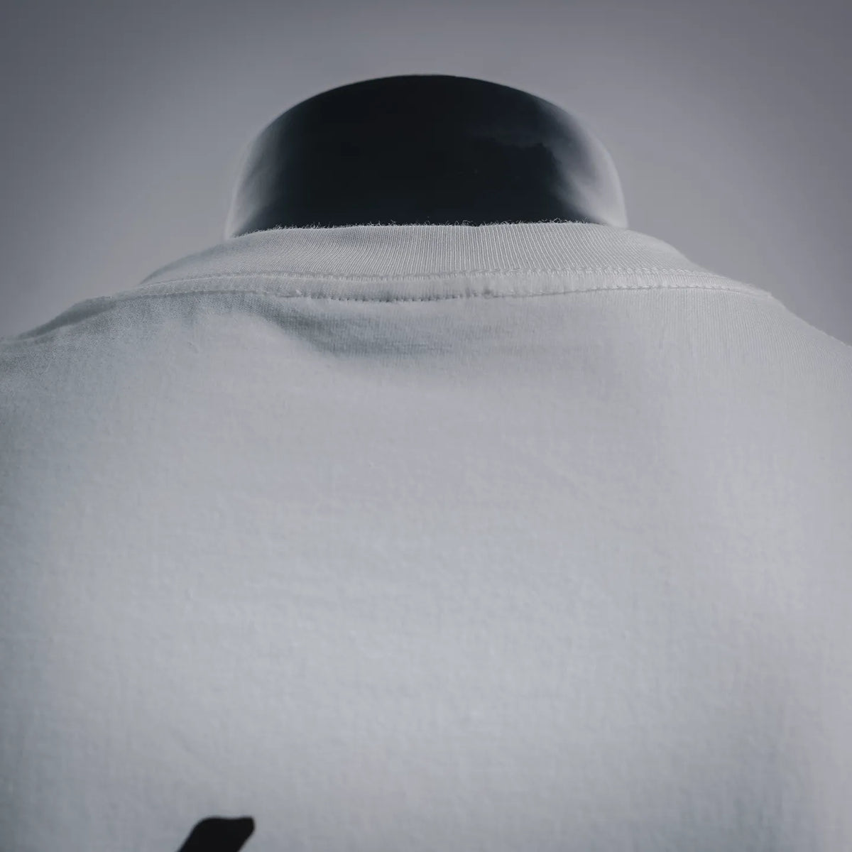 White T-shirt collar and upper shoulder seam close-up