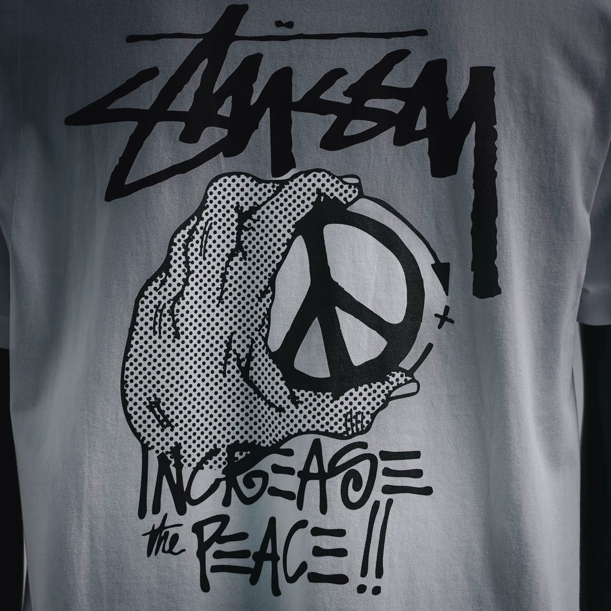 White short-sleeve T-shirt with large back peace hand graphic