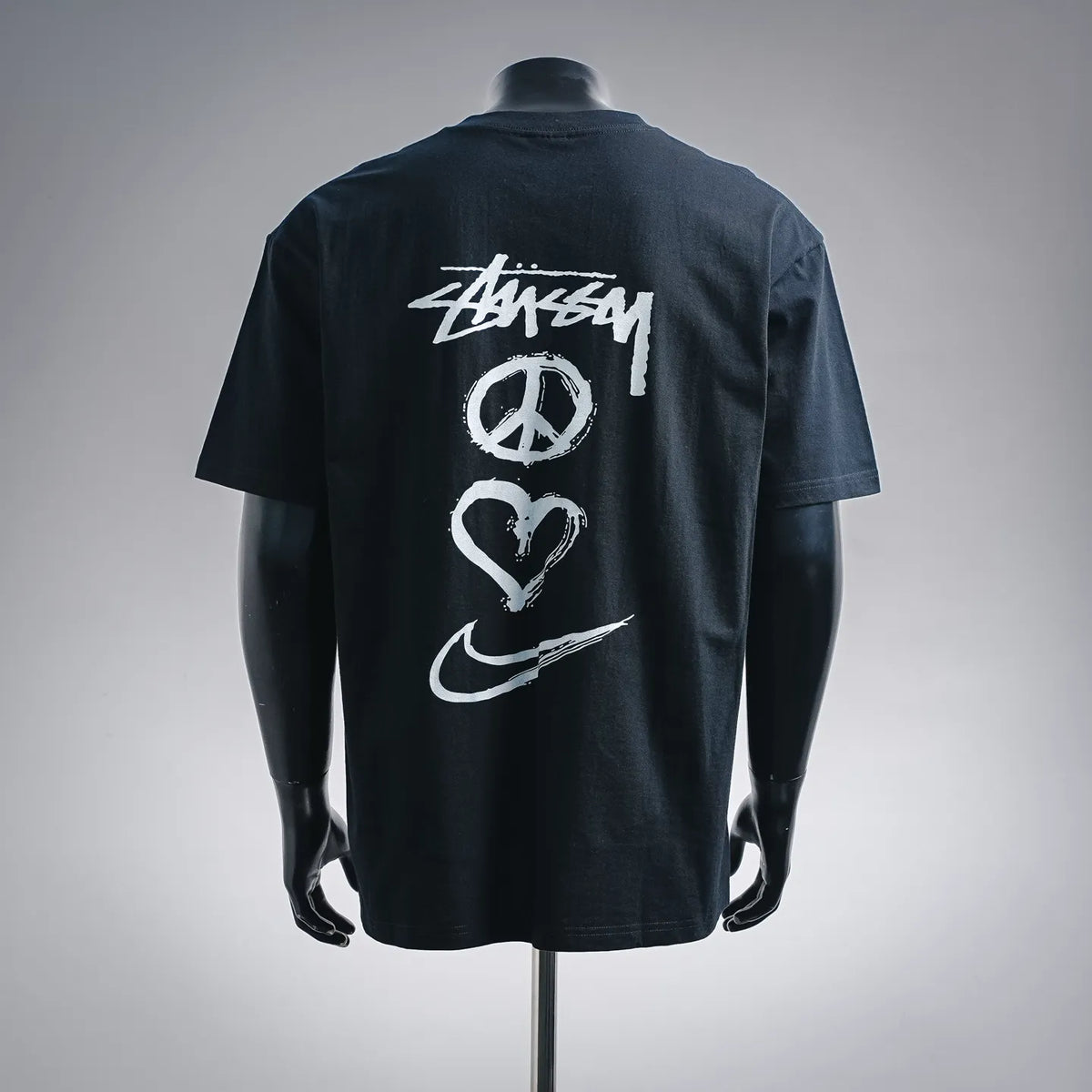 Black Stussy graphic T-shirt with crew neck and large back logo print