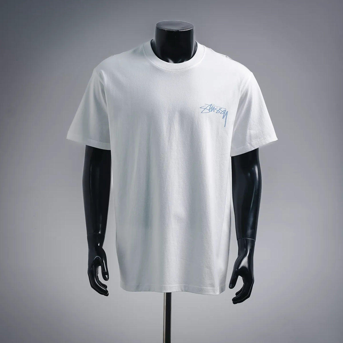 Stussy white short-sleeve T-shirt with blue logo at chest