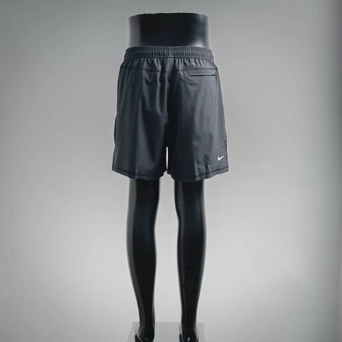 Dark gray elastic-waist shorts with Nike logo at side hem